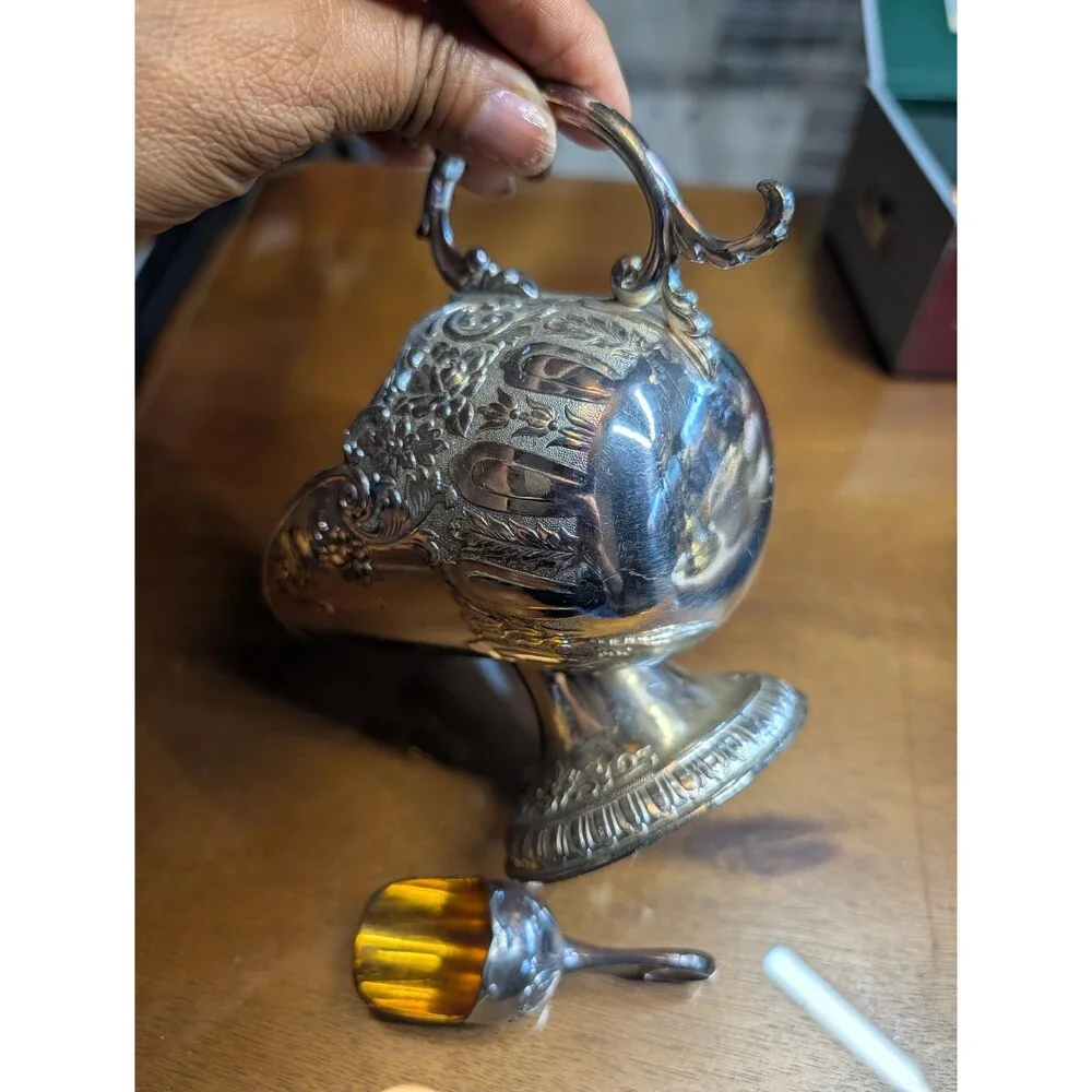 vintage silver-plated sugar scuttle with a matching mini scoop